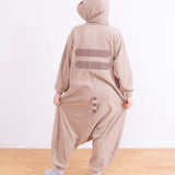 Model wearing the Pusheen Kigurumi with the hood pulled up, showing off the back of the one-piece. The back features two dark grey stripes and a striped tail, and Pusheen's face on the hood is partially visible. 