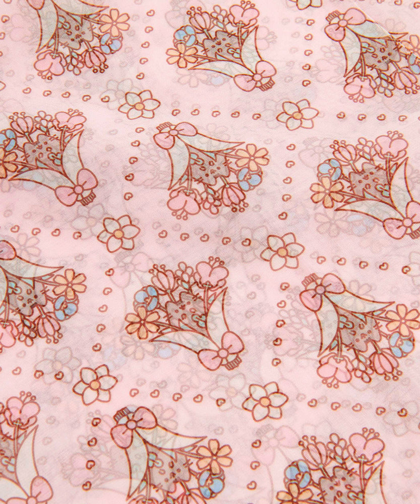 Close-up view of the print on the Pusheen Scarf. Pusheen sits within a wrapped floral bouquet with hearts and flowers in a diamond pattern throughout the scarf.