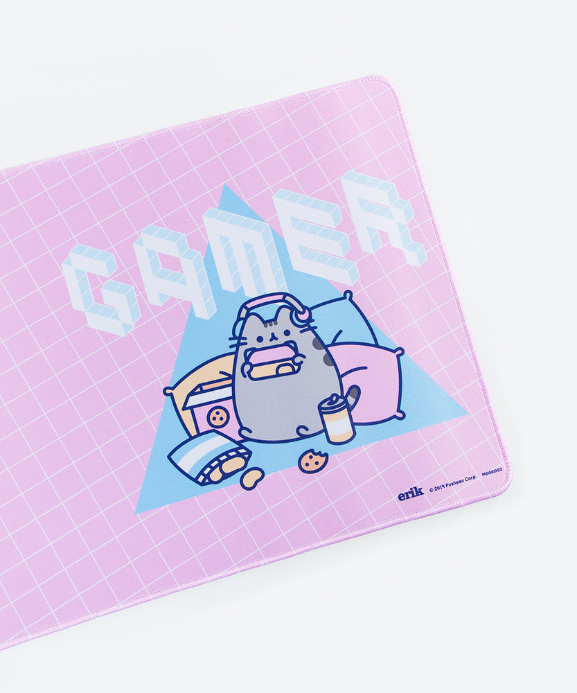 Angled close up of the Gaming Pusheen design on the Gaming Desk Mat. The isometric pixel text in the graphic have lines that indicate the font is made up of cubes.