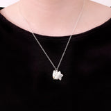 Model wearing the Pusheen Celestial Charm Necklace in the sterling silver finish to show the scale of the charm and chain. 
