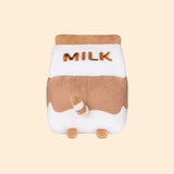 Back view of the Chocolate Milk Sips Plush. The back of the plush features the word ‘Milk’ in brown embroidery, plush back paws, and an extended white and brown striped tail. 