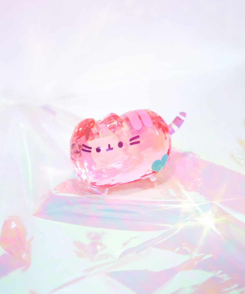 Top view of Pusheen Facets on a holographic surface. Figurine’s reflections can be seen in the multi-dimensional surface.  