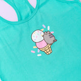 A close-up view of the tee’s screen print graphic. Pusheen the Cat climbs to the top of a two-tier ice cream cone. The top ice cream scoop is white with multi-colored sprinkles atop. The second scoop is a light strawberry color while the yellow cone has a black lattice outline. The center graphic is surrounded by pink, white, yellow, and purple sprinkles. 
