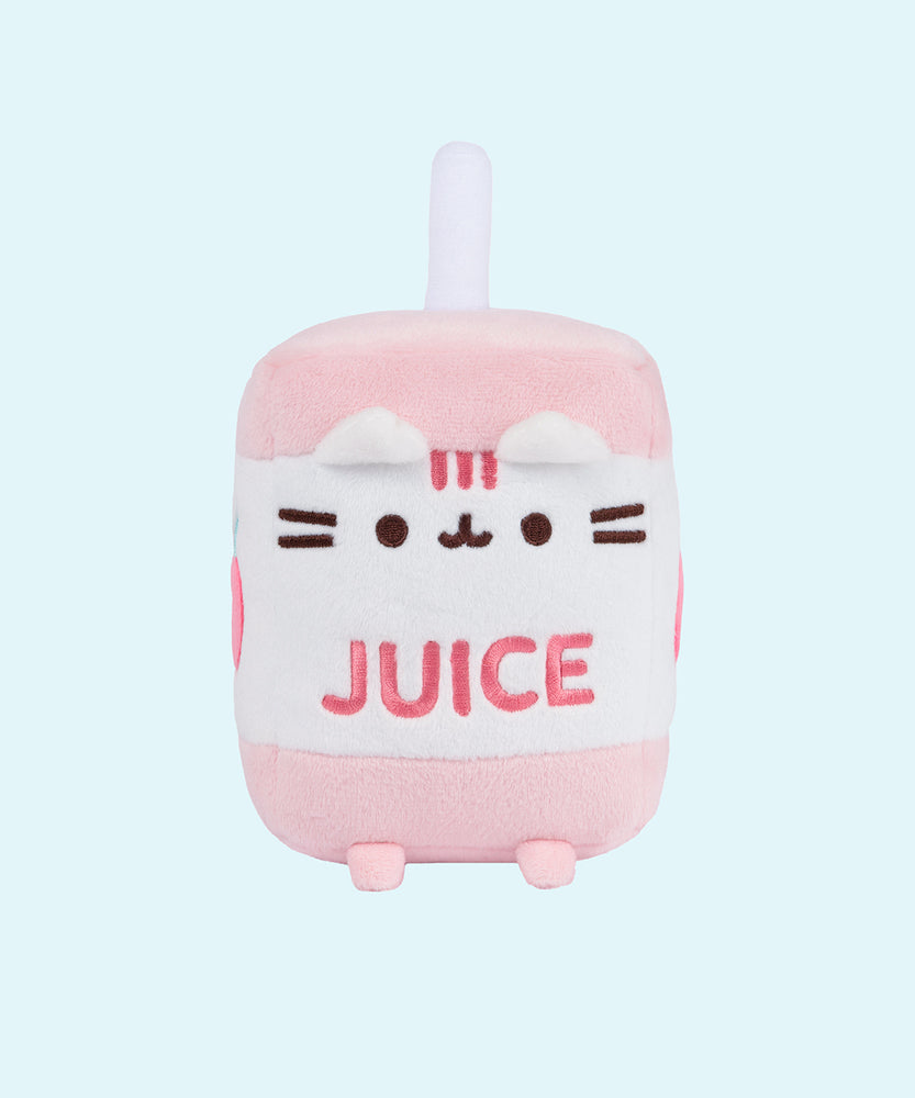 On a light blue background, the Juice Box Sips Plush shows off its white straw detail, plush pink feet, and white and pink striped tail that extends slightly off the body of the plush. 