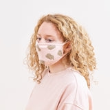 Model wearing the Pusheen Patterned Face Mask. The mask covers the nose and the bottom of the chin.