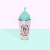 Front view of the Pusheen Whipped Tumbler. The iridescent tumbler cup features a printed Pusheen enjoying a vanilla milkshake out of a mint green cup with a red and white stripped straw. The top of the tumbler is a light green and mimics the shape of whipped topping. Out of the top of the tumbler is a rotating striped clear and mint green straw.