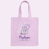 A purple canvas bag with pink, blue, purple, white, and grey, printed graphic ties on a flat background.