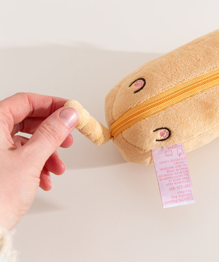Model holds tail feature that's attached to the bottom zipper that holds the nylon bag.