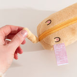 Model holds tail feature that's attached to the bottom zipper that holds the nylon bag.