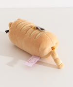 Back view of the baguette shaped plush keychain. The bottom zipper has Pusheen the Cat's striped tail attached. 