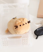 Front and side view of the yellow baguette shaped keychain plush.