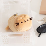Front and side view of the yellow baguette shaped keychain plush.