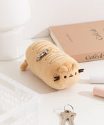 Aerial view of the baking lines atop the yellow plush as well as the top lobster claw clip.