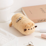 Aerial view of the baking lines atop the yellow plush as well as the top lobster claw clip.