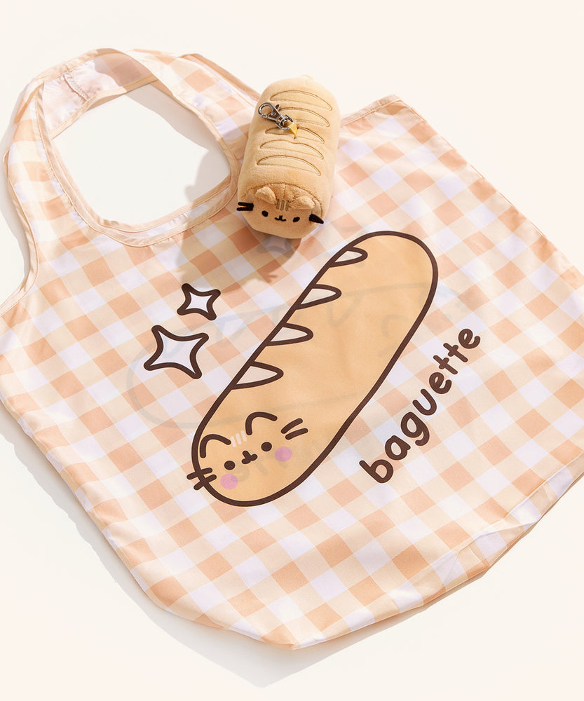 Yellow gingham nylon tote bag lies on a surface with the yellow baguette bag keychain holder. 