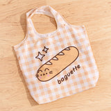 Pusheen Baguette graphic printed on a yellow gingham nylon bag.