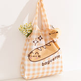 Nylon bag and storage keychain plush bag sat upright on a white background.