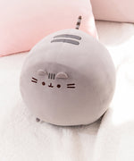 Secondary aerial view of the Big Pusheen Squisheen. The large grey plush has two grey head stripes embroidered on the very top of the plush.