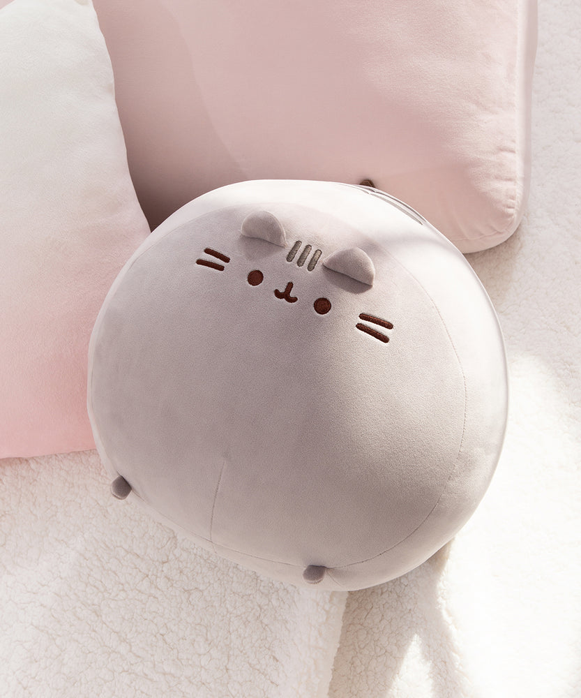 Full view of the front of the extra large plush cat. Two small feet are on the bottom of the plush and can be seen when looking at the plush head on.