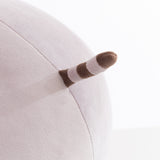 Close-up view of the tail that extends of the back side of the round plush. The tail is brown and gray stiped.