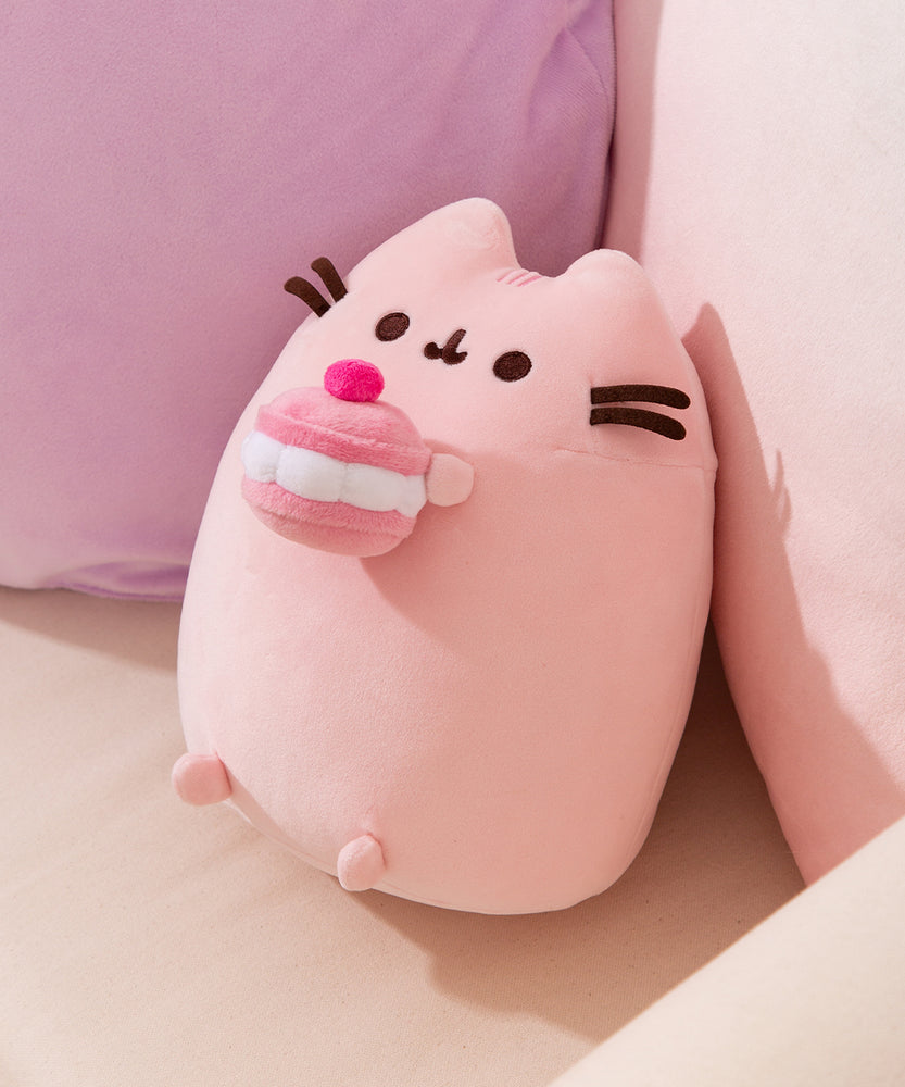 Side quarter view of the Cherry Plush. The larger plush sits upright and Pusheen's rounded triangle ears are molded at the top.