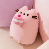 Side quarter view of the Cherry Plush. The larger plush sits upright and Pusheen's rounded triangle ears are molded at the top.