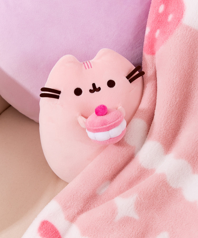 Pusheen Cherry Sweets plush tucked beneath the Sweets Blanket.