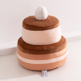 Back view of the Chocolate Cake plush. The large two-tiered cake plush has brown icing on each tier.