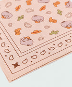 Close-up print of the pusheen cowboy-themed banner. The light brown scarf has digitally printed brown, grey, and green graphics.