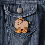 Pusheen cowboy pin attached to dark denim jacket.