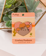 Large pusheen pin has gold foil outline that highlights heart shape of pin.