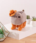 Quarter side view of the Pusheen plush. Pusheen's four paws are wearing cowboy boots.