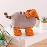 Side view of the Pusheen Cowboy Plush. The miniature cowboy hat covers a portion of Pusheen's head and back. 