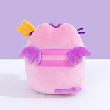Back view of Devil’s Food Cake Pusheen Plush. This view shows Pusheen’s pink back stripes, purple wings, and purple forked tail.  