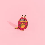 Pusheen Year of the Dragon Pin. Pusheen wears a red and gold dragon costume. The red dragon has a gold neck trim, belly, and tail details. THe middle of the pin has scale details in gold plating.