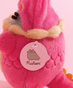 Close-up view of light pink Pusheen logo tag and embossed Pusheen Label tag.