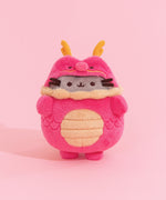 Front view of Pusheen Year of the Dragon Plush. The grey fluffy Pusheen wears a fluffy red dragon costume with gold details at the horns, whiskers, collar, and belly.