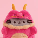 Close-up of Pusheen wearing a red and gold dragon costume. The red dragon costume has gold horns, whiskers, neck trim, and belly details.