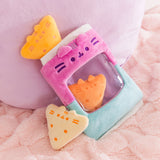 Three plush tortilla chip inspired plush sit in and around the included plush bag. Both the chips plush and bag have Pusheen the Cat's face embroidered on them.