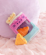 Tortilla chips inspired plush are shown within and outside of the bag of chips plush bag. 