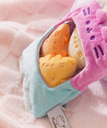 Side view of the Bag of Chips Plush to show the texture of the purple and blue two-toned plush bag.