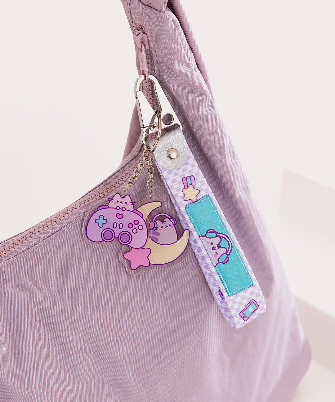 Gamer Controller Keystrap attached to a purse to show the size and scale of the keystraps.