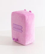 Side and back view of the Pusheen Gamer Handheld Console Plush. Pusheen's two back stripes are embroidered in purple in the middle back of the plush. Extending off the back of the plush is Pusheen's pink and purple striped tail. 
