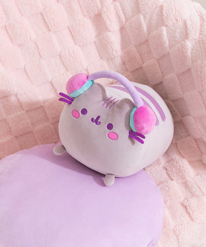 Aerial view of the gaming log plush. Pusheen's two back stripes are embroidered on her back in purple.