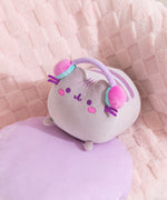 Aerial view of the gaming log plush. Pusheen's two back stripes are embroidered on her back in purple.