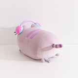 Back view of the gaming pusheen log plush. The cat's purple and gray striped tail can be seen extending off the back of the plush as well as two tiny grey paws behind the plush.