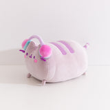 Side view of the long chunky cat plush. The rotund plush features a cat lying down with her four paws extending off the front and back.