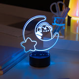 Neon light of Pusheen the Cat wearing headphones while sitting on a crescent moon. The LED light is set to the color white. 