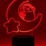 Red neon light shaped with a crescent moon, star, and Pusheen the Cat wearing headphones.