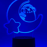Blue neon light shaped with a crescent moon, star, and Pusheen the Cat wearing headphones.